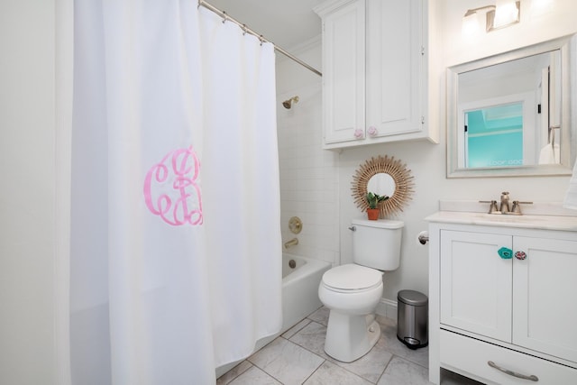 bathroom featuring toilet, shower / bath combo with shower curtain, marble finish floor, and vanity