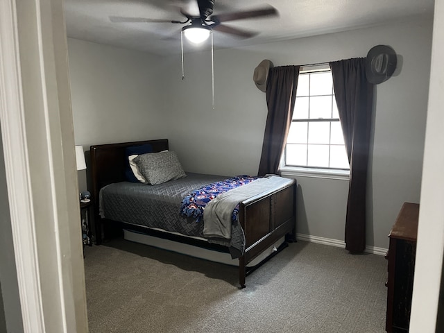 bedroom featuring carpet flooring, a ceiling fan, and baseboards