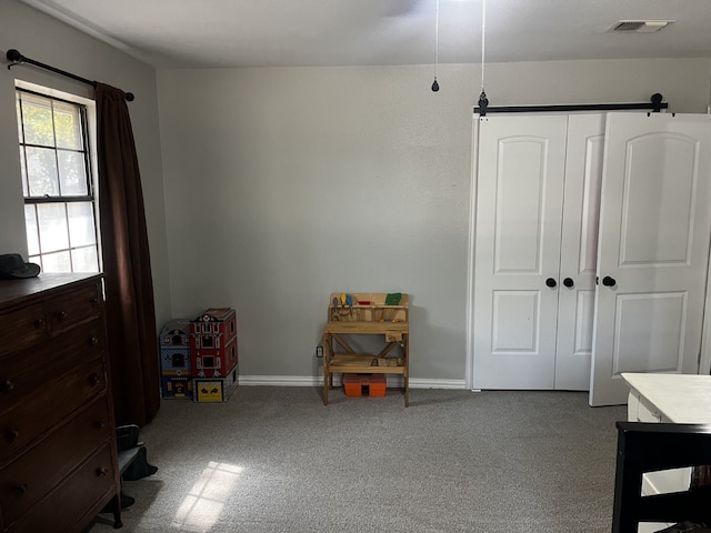 interior space with visible vents, carpet flooring, and baseboards