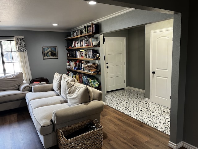 living area with crown molding, recessed lighting, baseboards, and wood finished floors