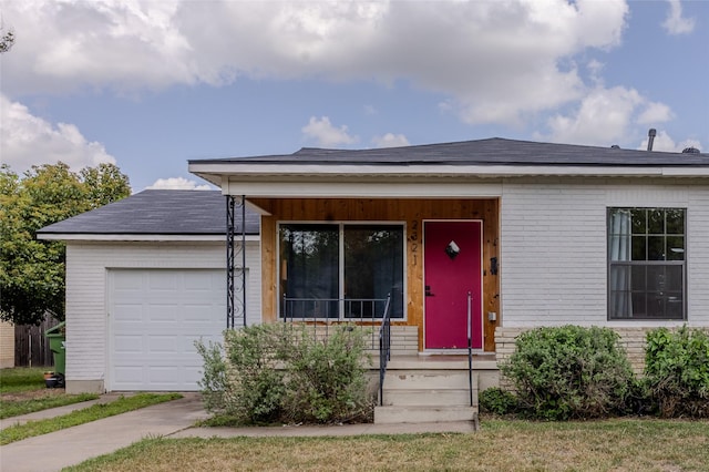ranch-style home with brick siding and a garage