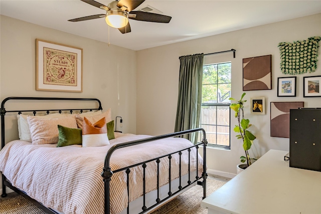 bedroom featuring baseboards and a ceiling fan