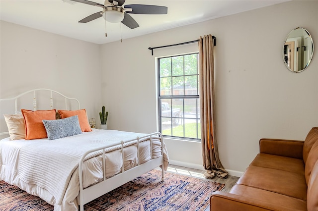 bedroom featuring baseboards and a ceiling fan