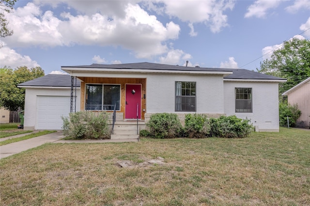 ranch-style home featuring a garage, driveway, and a front yard