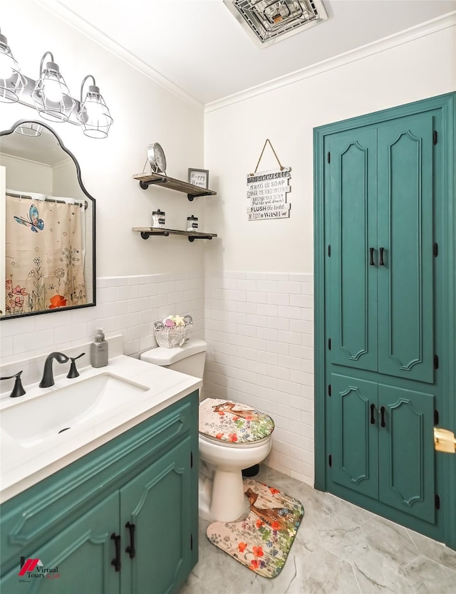 full bathroom featuring visible vents, ornamental molding, vanity, toilet, and tile walls