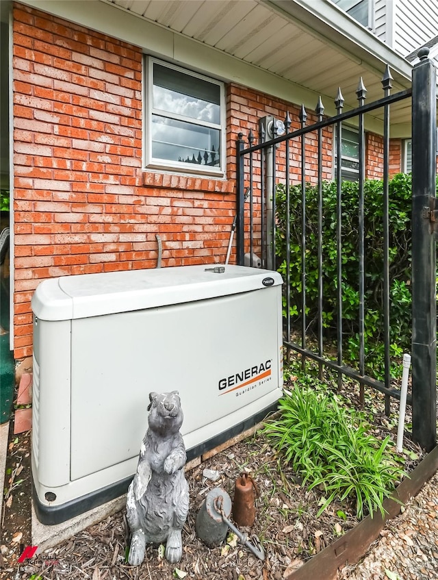exterior details with brick siding and a power unit