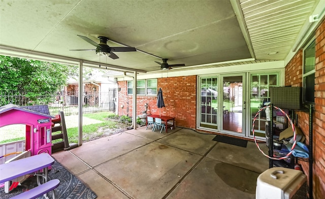 view of patio featuring fence and ceiling fan