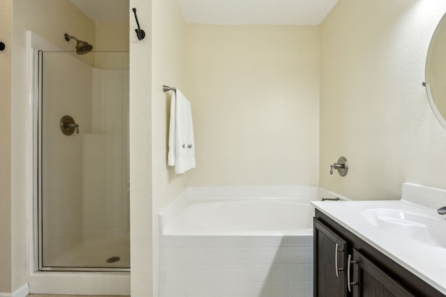 full bath featuring vanity, a shower stall, and a bath