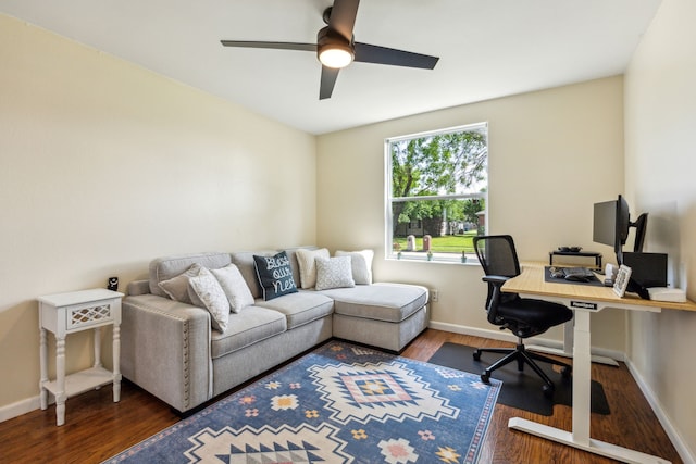 office featuring a ceiling fan, baseboards, and wood finished floors