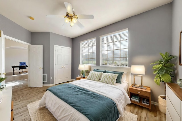 3017 Holford Rd, Richardson, TX 75082 - bedroom featuring baseboards, light wood finished floors, a closet, and ceiling fan