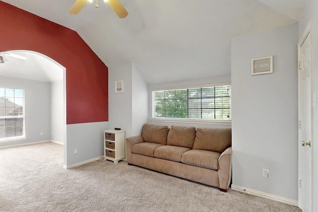 3017 Holford Rd, Richardson, TX 75082 - carpeted living room with vaulted ceiling, arched walkways, a ceiling fan, and baseboards