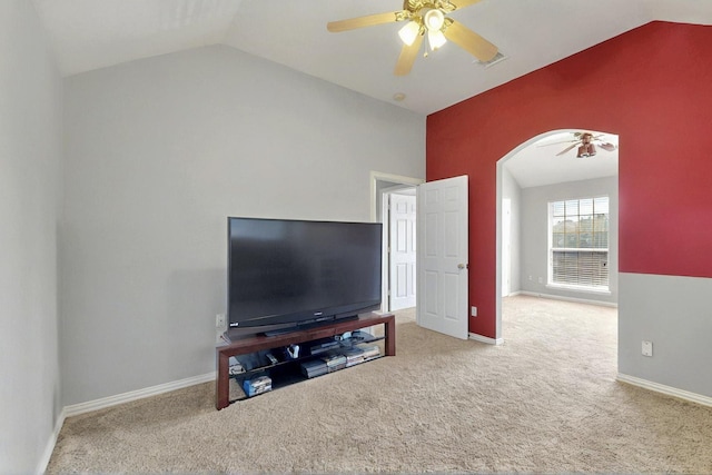 3017 Holford Rd, Richardson, TX 75082 - carpeted living room with lofted ceiling, a ceiling fan, arched walkways, and baseboards
