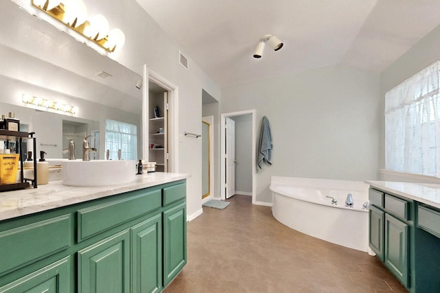 3017 Holford Rd, Richardson, TX 75082 - bathroom featuring a shower stall, a tub, vanity, and vaulted ceiling