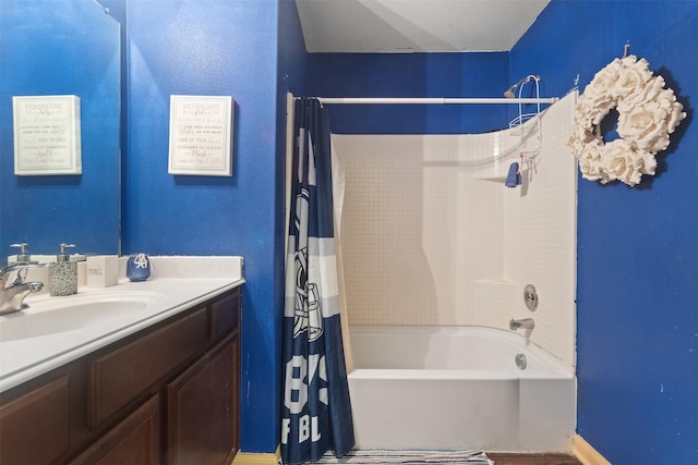 full bathroom featuring vanity and shower / bathtub combination with curtain
