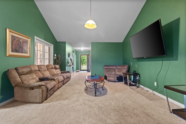 carpeted living room featuring baseboards and vaulted ceiling