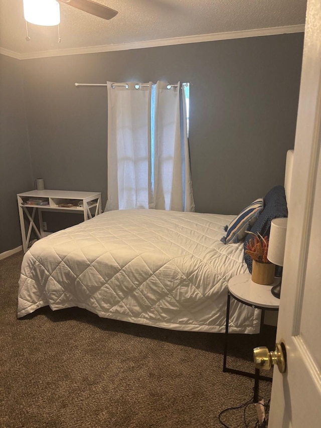 bedroom featuring carpet flooring, a textured ceiling, and ornamental molding