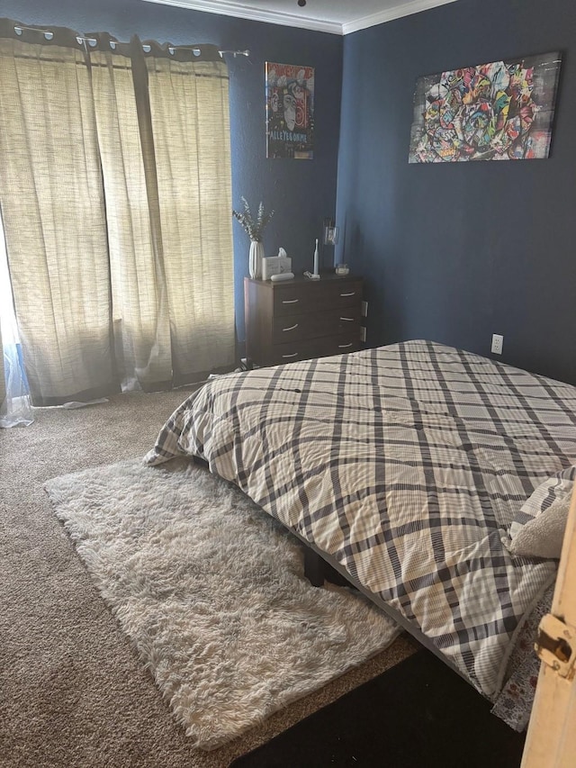 carpeted bedroom with ornamental molding