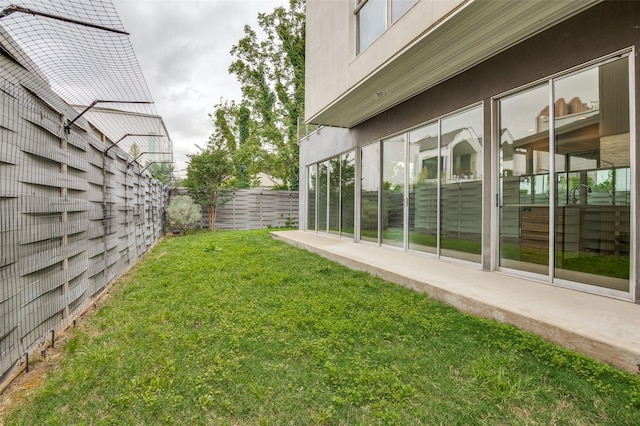 view of yard with fence and a patio area
