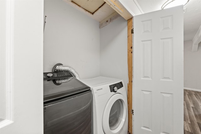 2301 Connor Ave, Waco, TX 76706 - clothes washing area with laundry area, washing machine and dryer, and wood finished floors