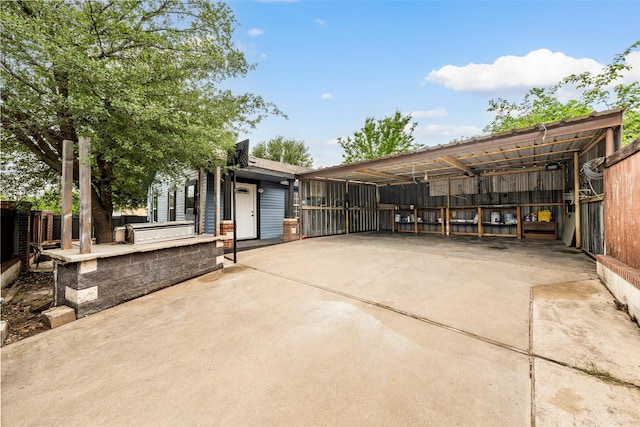 2301 Connor Ave, Waco, TX 76706 - exterior space featuring area for grilling, fence, driveway, and a carport