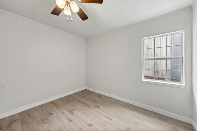 2301 Connor Ave, Waco, TX 76706 - spare room with baseboards, ornamental molding, ceiling fan, and wood finished floors
