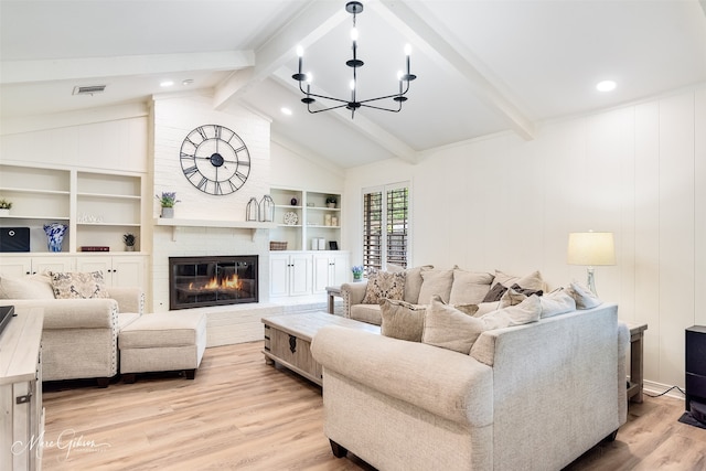 6309 Time Pl, Shreveport, LA 71106 - living room with a chandelier, light wood finished floors, and a brick fireplace