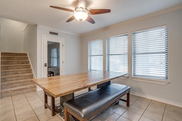 7116 Westover Dr, Granbury, TX 76049 - dining room with light tile patterned flooring, a ceiling fan, ornamental molding, and stairway