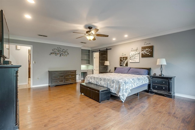 7116 Westover Dr, Granbury, TX 76049 - bedroom with baseboards, ornamental molding, a barn door, and visible vents
