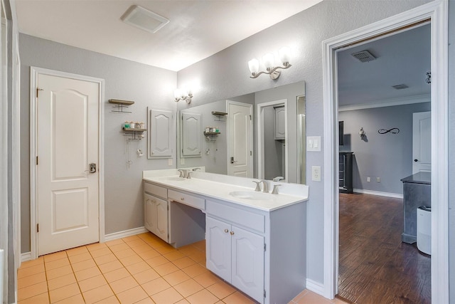 7116 Westover Dr, Granbury, TX 76049 - bathroom featuring double vanity, visible vents, and a sink