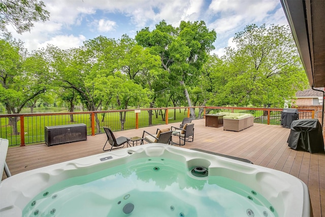 7116 Westover Dr, Granbury, TX 76049 - wooden deck with hot tub deck surround and an outdoor living space