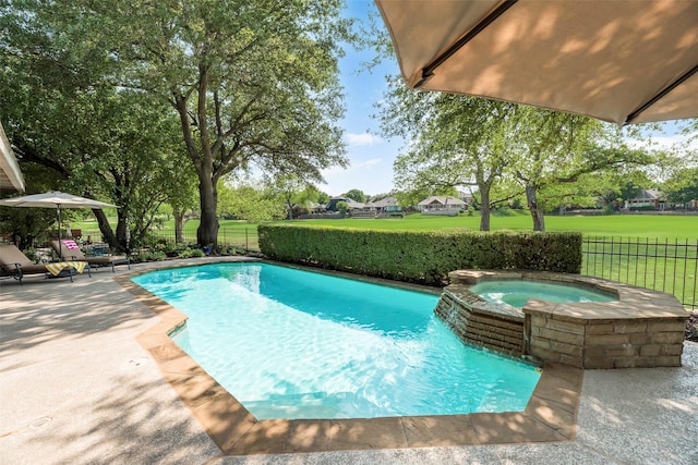 view of pool with a patio, fence, and a pool with connected hot tub