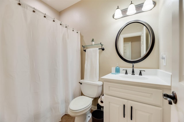 bathroom featuring toilet, curtained shower, and vanity