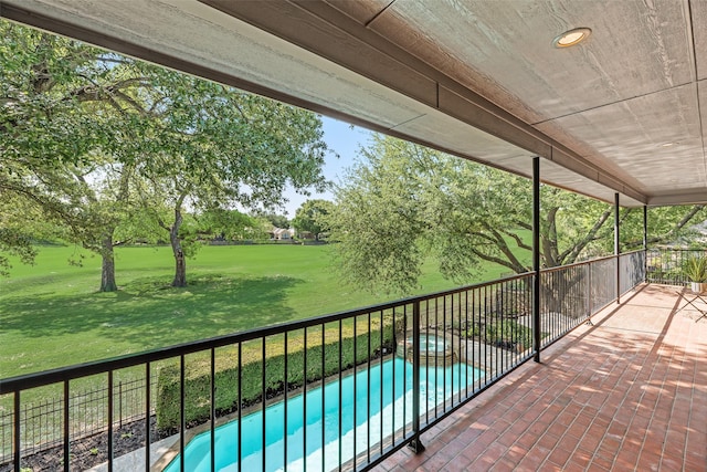 view of patio featuring a pool with connected hot tub