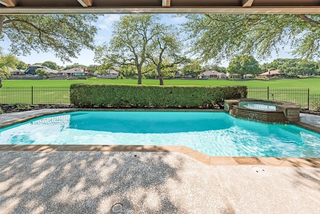 view of swimming pool with a fenced backyard, a patio area, a lawn, a pool with connected hot tub, and a residential view