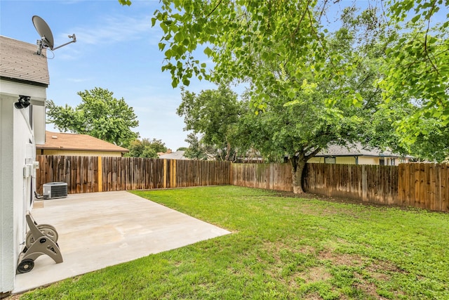 view of yard with a fenced backyard, a patio, and cooling unit