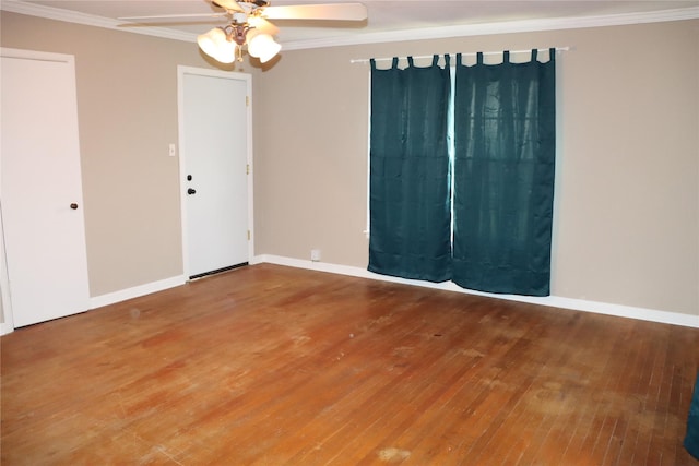 unfurnished room with crown molding, ceiling fan, baseboards, and hardwood / wood-style floors