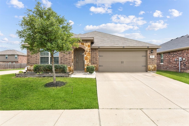 994 Decker Dr, Fate, TX 75189 - view of front of property with an attached garage, driveway, and brick siding