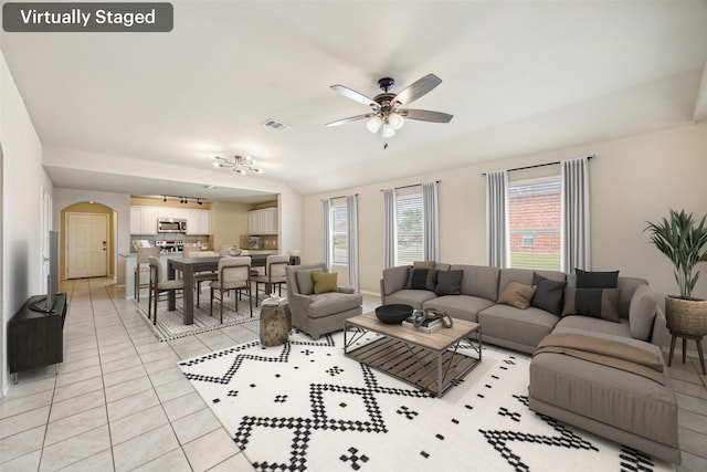 994 Decker Dr, Fate, TX 75189 - living area featuring ceiling fan, arched walkways, and light tile patterned floors