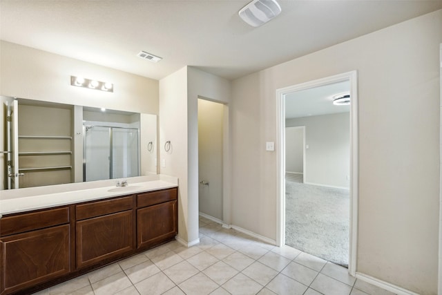 994 Decker Dr, Fate, TX 75189 - full bathroom featuring a shower stall, baseboards, vanity, and tile patterned flooring