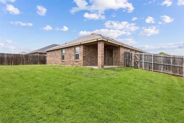 994 Decker Dr, Fate, TX 75189 - rear view of house featuring brick siding and a patio area