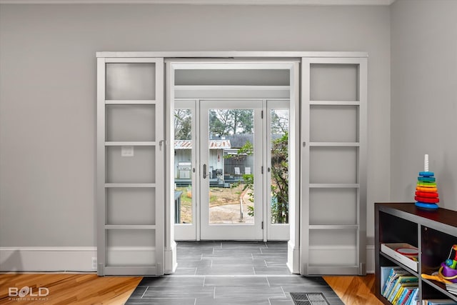 doorway to outside with wood finished floors