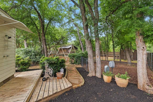 view of yard featuring a deck and a fenced backyard