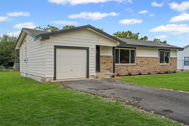 single story home featuring aphalt driveway, a front yard, brick siding, a shingled roof, and an attached garage