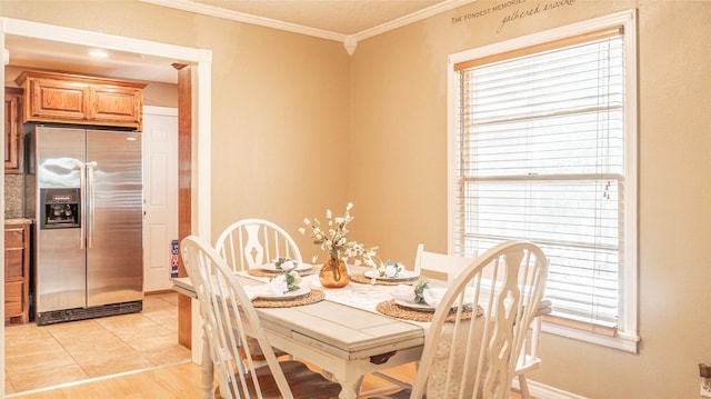 dining area featuring ornamental molding