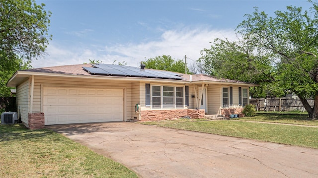 single story home featuring fence, a front lawn, stone siding, a garage, and driveway