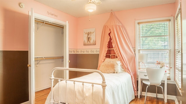 bedroom featuring a closet and wood finished floors