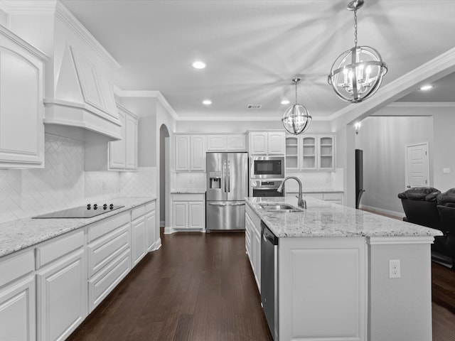 kitchen with recessed lighting, a sink, a notable chandelier, and stainless steel appliances