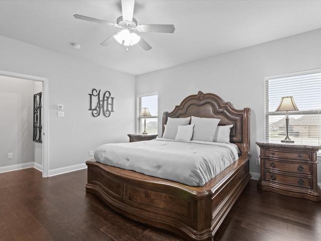 bedroom featuring baseboards, a ceiling fan, and wood finished floors