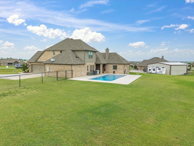 view of pool featuring a fenced backyard, a patio, and a yard