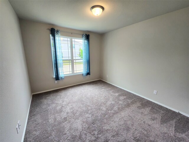 10076 Travis Dr, Providence Village, TX 76227 - carpeted spare room featuring baseboards